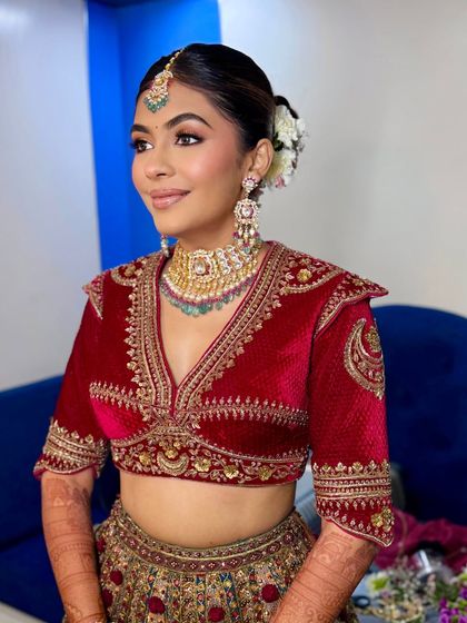 This image shows the beautiful structure of the velvet blouse and how the makeup complements the rich texture and color.