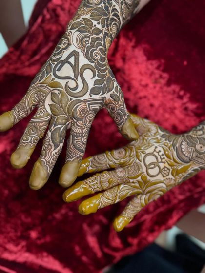 An engagement design with the couple's initials 'A' and 'S' and interlocking rings.