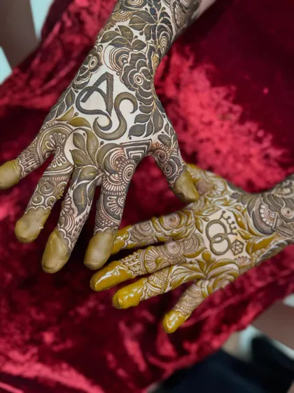 An engagement design with the couple's initials 'A' and 'S' and interlocking rings.