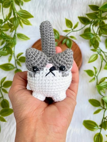 A grumpy but cute little cat plushie. I love his expressive face! This was a custom order to replicate a customer's pet, and I'm so happy with how he turned out.