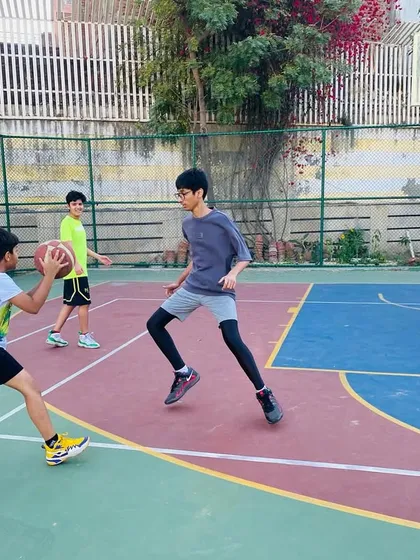 A player practices his shooting form while a coach observes. We provide instant feedback to make adjustments.