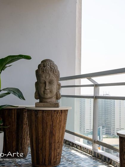 Explore a variety of outdoor retreats I have designed. From cozy balconies with patterned tiles and Buddha statues to expansive terraces with vertical gardens and lounge seating, each space is crafted to be a personal haven.