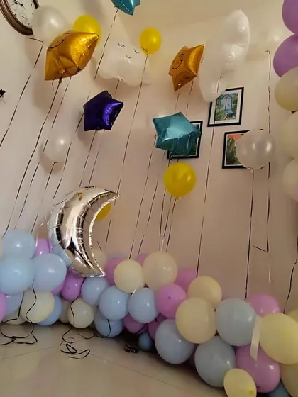 A simple yet sweet decoration for a small space. This pastel balloon garland is mixed with star and moon shaped foil balloons, perfect for a "Twinkle Twinkle Little Star" theme at home.