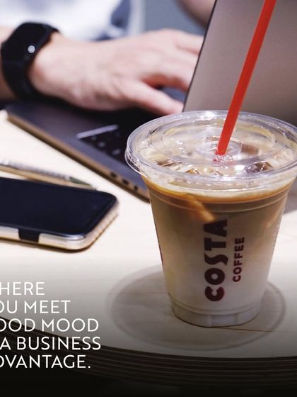 Where you meet matters. A good mood and a great environment are a business advantage. This shot from Costa Coffee shows an ideal setup for a productive and positive work session.