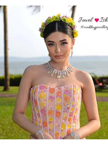 A beautiful portrait of the bride in her complete Mehendi look. The yellow diamond necklace adds just the right amount of sparkle to her vibrant, floral ensemble.