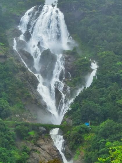 A classic view of Dudhsagar Falls with the railway bridge, showcasing the unique landscape of this Goa-Karnataka border trek.