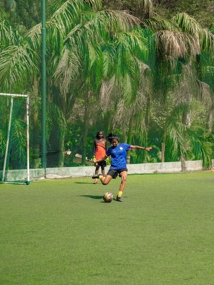 A friendly game of football on our green turf, surrounded by palm trees. A perfect way to spend an afternoon.