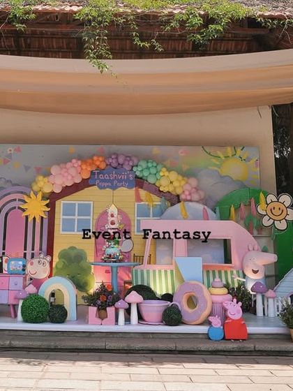 A slightly different angle of the expansive Peppa Pig setup, highlighting the train in the foreground and the detailed backdrop.