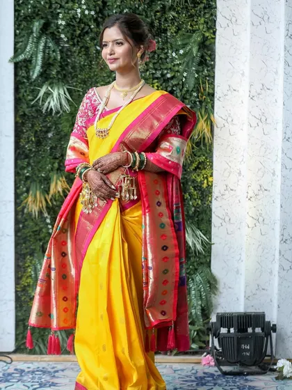 I loved creating this traditional Maharashtrian bridal look for Siddhi. The bright yellow and pink paithani saree was the star, so we kept her makeup fresh and glowing with a classic bun. 💕