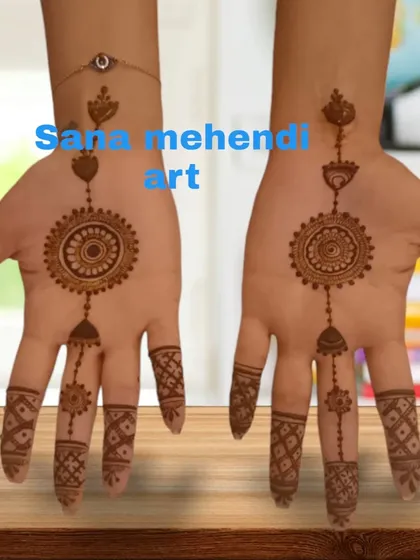 A minimalist jewelry-style design, featuring a central mandala connected to the fingers with delicate chains, mimicking a haath phool.