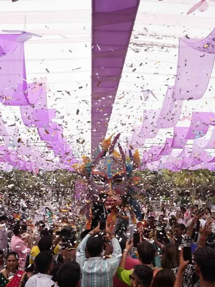 The view from the crowd as the carnival float makes its way through a blizzard of confetti. An absolutely epic moment.