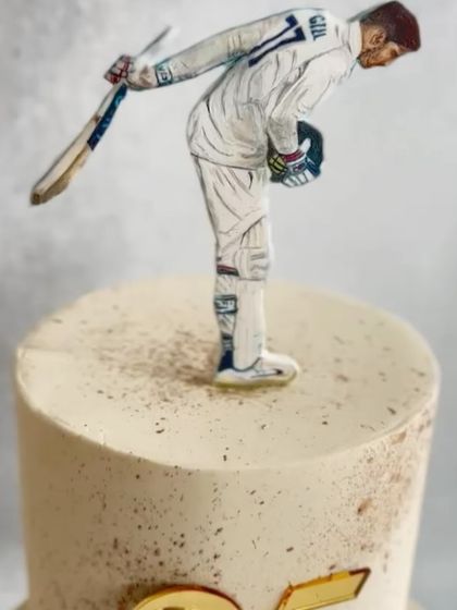 Another look at the hand-painted topper, showing the detail and artistry that went into this special commission.