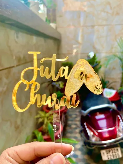Let's have some fun with tradition! This "Juta Churai" topper is perfect for adding a playful and unique touch to your wedding festivities. I love creating designs that celebrate our vibrant Indian wedding ceremonies.