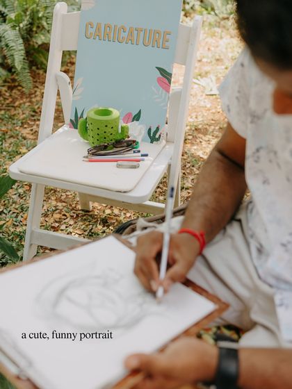 A live caricature artist provides a fun and personal keepsake for guests. It's a great way to capture the joy of the day and give everyone a unique portrait to take home.