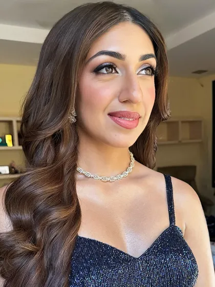 A beautiful close-up of Sheena's sangeet makeup. You can see the soft shimmer on the eyes and the healthy glow on her skin, a perfect combination for a night of celebration.