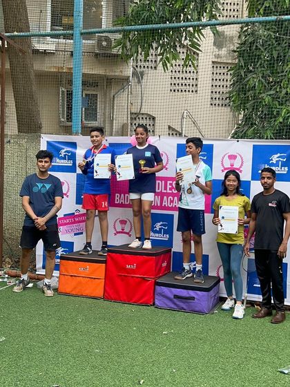 Our older students also shine. Here are the winners from another age category of our badminton tournament, showcasing their skill and sportsmanship.