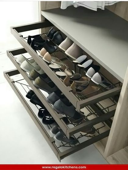 These tiered, pull-out wire baskets are perfect for storing shoes or folded garments, allowing for air circulation and easy visibility of the contents.