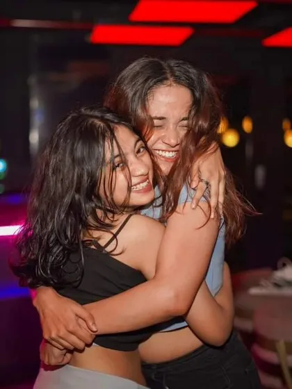 Hugs and smiles on the dancefloor at Toca Brigade. It's a place for friends to connect and celebrate.
