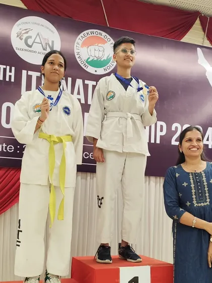 Two of our female competitors on the podium, demonstrating the strength and success of women at our academy.