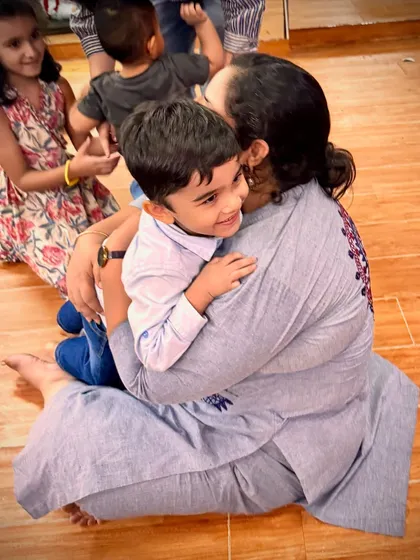 Pure happiness captured in a hug. These authentic interactions are the heart of our "love, laugh, learn" philosophy.