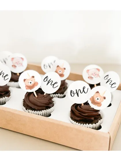 A bear-y sweet first birthday. These eggless chocolate cupcakes with custom "one" and teddy bear toppers are perfect for treating little guests.