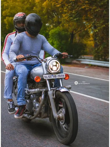 Action shots are an exciting part of lifestyle photography. This panning shot captures the motion of the motorcycle on the road, creating a dynamic image that tells a story of travel and adventure.