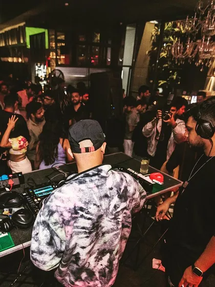 A view from behind the console, showing my collaboration with another DJ at Raahi.