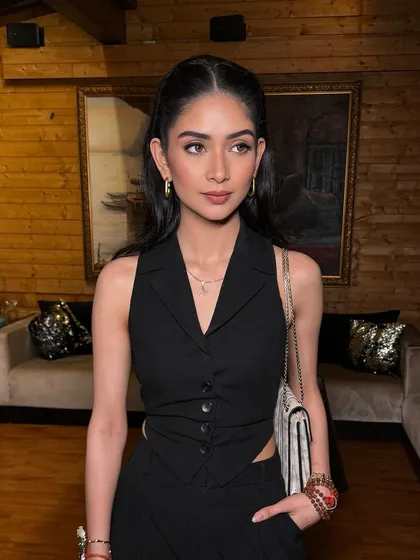 Power glam for the star girl Atisha. A sleek half-ponytail paired with a bold lip creates a powerful and chic look.