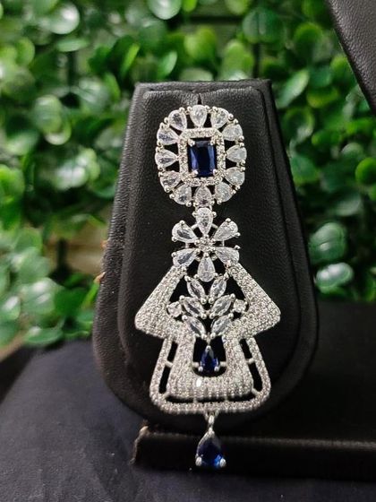 Another view of the earring from the popular sapphire-blue AD set, perfect for a glamorous evening look.