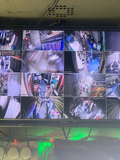 A 16-camera view monitoring a busy market area in Chandni Chowk. Our systems are built to handle high-traffic commercial environments.