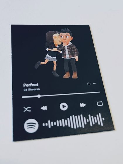 A unique Spotify card featuring Bitmoji characters instead of a photo, paired with Ed Sheeran's "Perfect."