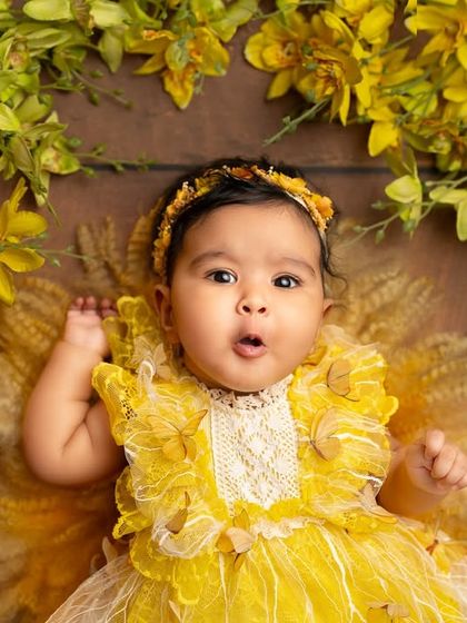 A look of surprise and curiosity from this little one. Capturing these fleeting expressions is what makes milestone photography so special.
