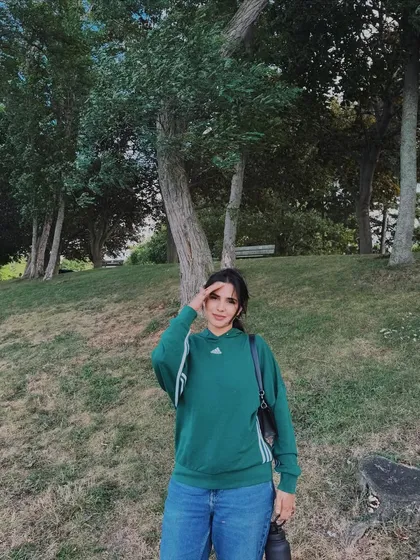 Another shot from my day out, showing a casual green Adidas sweatshirt and jeans. It's a simple, relatable, and authentic outfit post.