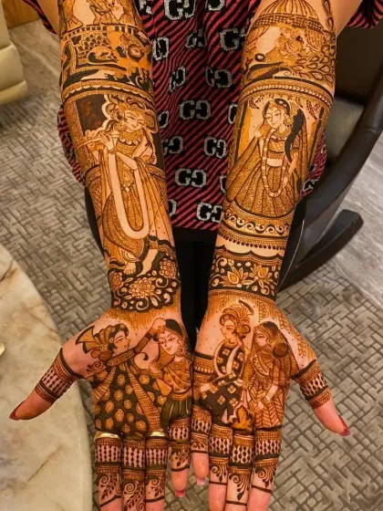 This design is a gallery of portraits, featuring Radha Krishna, a bride, and a couple, all woven together with intricate patterns.