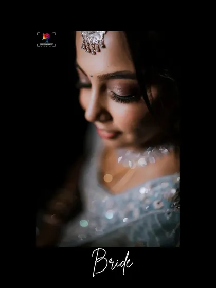 A soft and delicate close-up portrait of a bride. The focus on her face and the gentle lighting create a dreamy and intimate feel.
