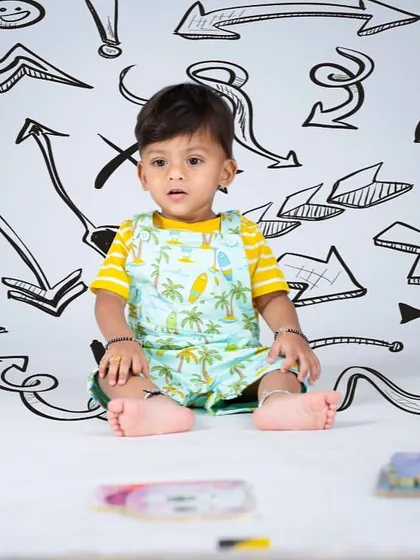 A simple yet creative setup with hand-drawn arrows and symbols. This theme is great for capturing a child's dynamic energy.
