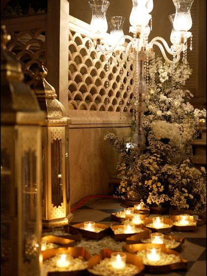 A detail of the lighting for the all-white Sufi night. Ornate lanterns and candles were placed on the floor, illuminating the intricate jaali work and floral arrangements from below.