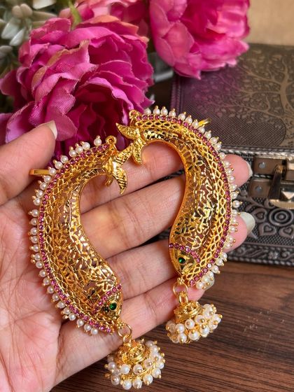 Our fish-design ear cuffs with red and green stones and pearl jhumkas. This is a unique and traditional design.