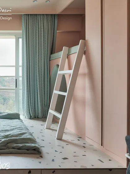 A view of the loft bed ladder in the Red Fort Project. The simple white ladder provides access to the upper play space while contrasting with the soft pink walls and terrazzo-style platform.