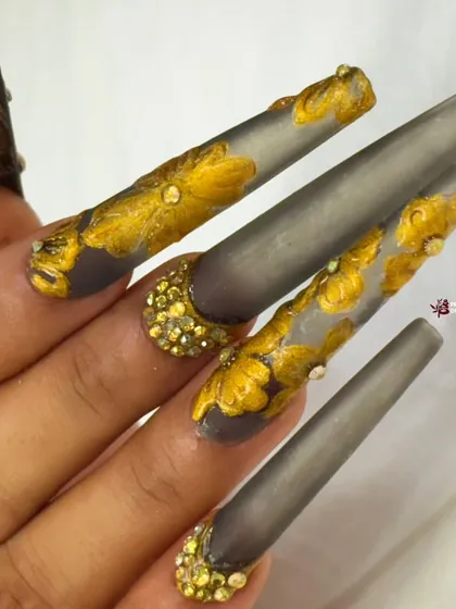 A close-up view of the gold leaf and crystal details, showing the texture and artistry of this unique and glamorous design.