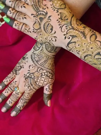 A different pose showing how the Indo-Arabic design looks when the hands are crossed. The flowing patterns create a beautiful, continuous piece of art.