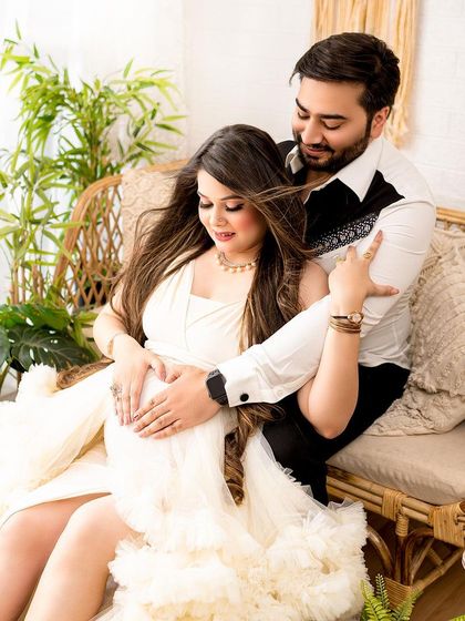 A sweet moment where the parents-to-be make a heart shape on the baby bump. It’s these small, symbolic gestures that make a photoshoot so special.