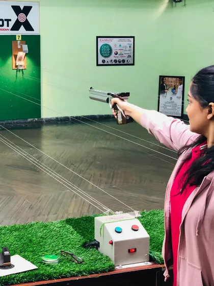 This shooter takes aim at our green-themed range, which offers a unique and pleasant practice environment.