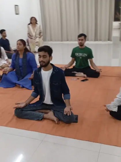 A full view of the participants during a meditation session. The simple act of sitting together in silence is a powerful practice.