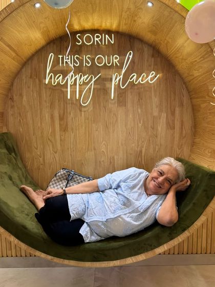 A client completely at ease, lounging in our signature circular chair. This is the picture of pure relaxation that we aim to provide.