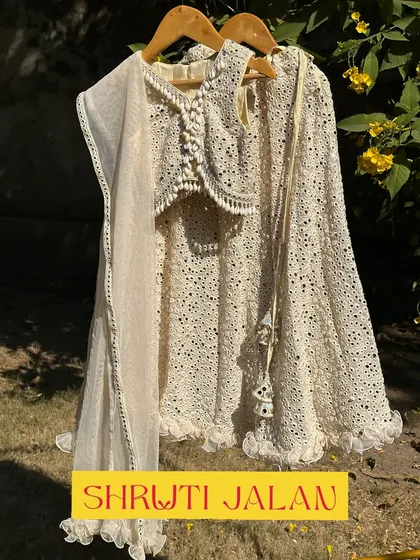 The cream mirror-work lehenga. A timeless and elegant piece for any special occasion.