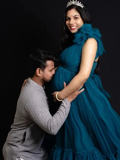 A kiss for the baby from the proud father to be. This is such a tender and classic maternity pose that beautifully shows the bond he already has with his little one.