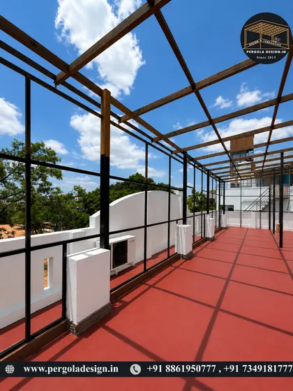 Another angle of the expansive rooftop pergola frame, showing the clean lines and strong shadow patterns.