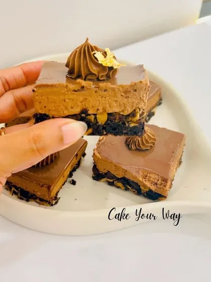 A close-up of my Bournvita Milk Bar, a nostalgic treat for anyone who grew up with the flavor. It has a crunchy biscuit base, a creamy Bournvita-infused mousse, and a smooth chocolate topping.