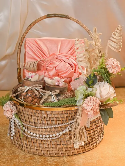 A closer look at the details of this stunning Rakhi basket. The combination of the satin-wrapped box, pearl strings, and dried flowers creates a truly luxurious and memorable gift.